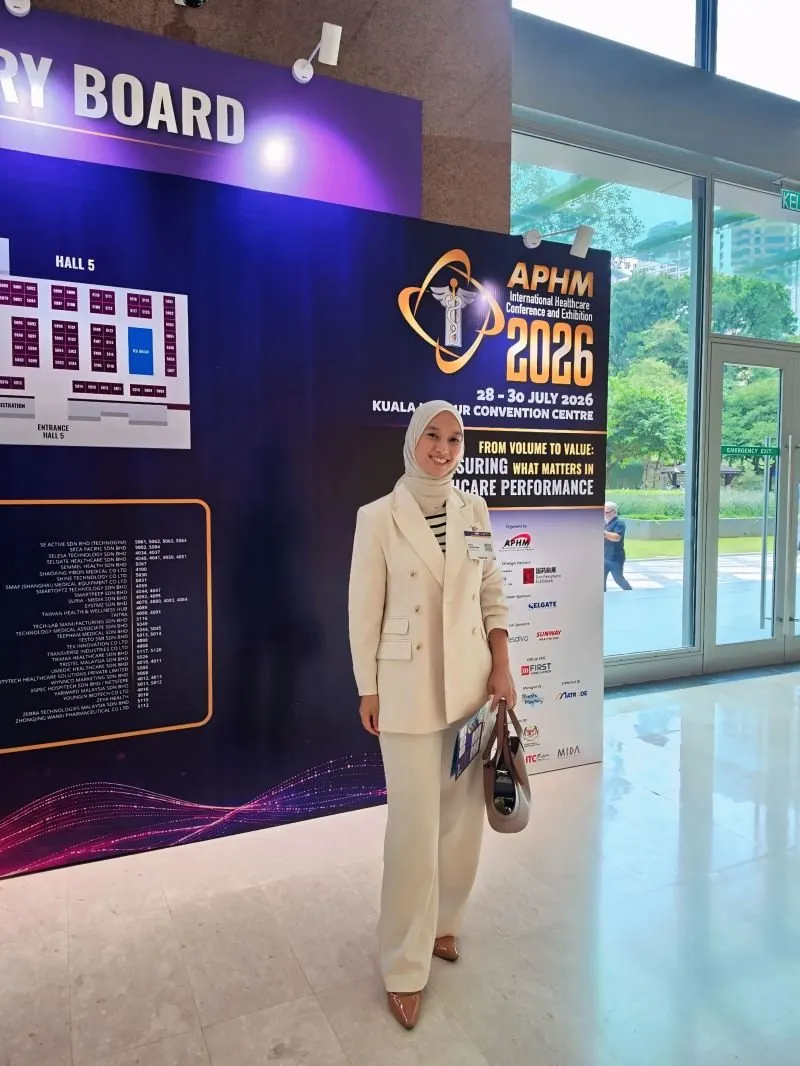 Nura smiling at the APHM International Healthcare Conference and Exhibition 2026 in Kuala Lumpur